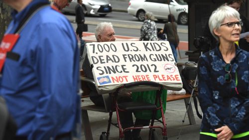 Protestors gather at Martin Place in Sydney in support of March For Our Lives. (AAP)