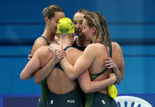 Ariarne Titmus, Emma McKeon, Madison Wilson and Leah Neale of Team Australia react after winning the bronze medal in the Women's 4 x 200m Freestyle Relay Final.