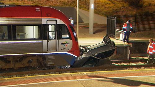 A train has collided with an unoccupied care on the tracks in Adelaide.