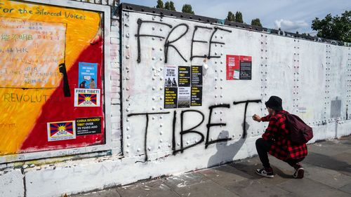 Chinese Communist Party slogans spark graffiti war on London's