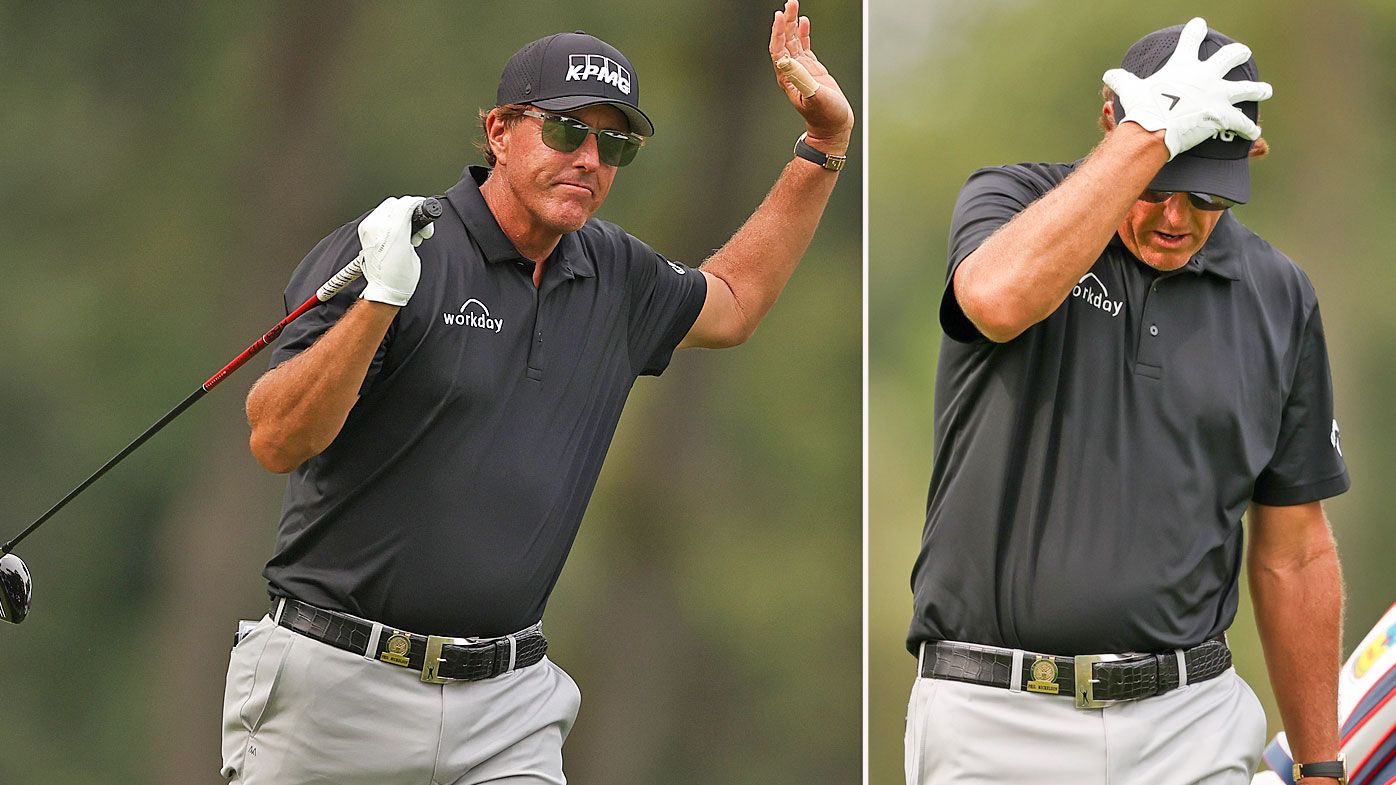 Phil Mickelson of the United States reacts to his shot from the eighth tee