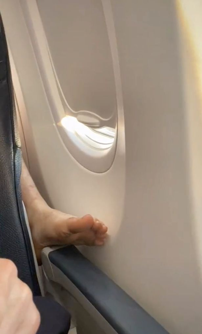 TikToker secretly films act of revenge on rogue foot on armrest