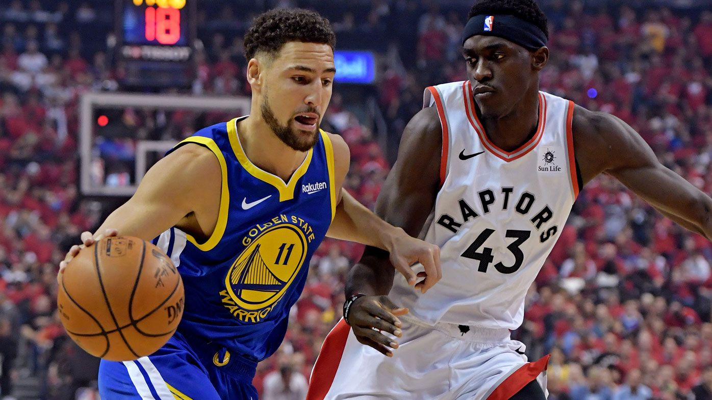 Klay Thompson drives to the basket against Toronto Raptors forward Pascal Siakam