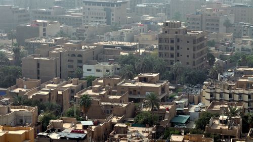 This skyline of downtown Baghdad with rooftops and terraces is a very typical urban view seen all over the Middle East.