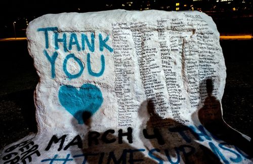 A painted rock includes the names of the women who gave victim impact statements during the trial against Larry Nassar. (File photo, AAP)