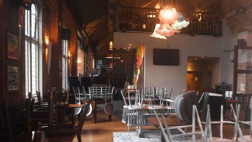 A view through the window into 'The Mill' pub which has been cordoned off by police in Salisbury, Britain. (EPA/AAP)