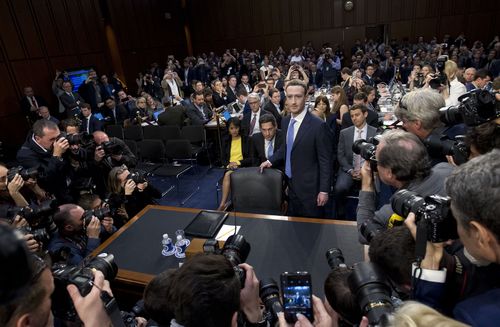 Facebook CEO Mark Zuckerberg arrives to testify before a joint hearing of the Commerce and Judiciary Committees on Capitol Hill in Washington, Tuesday, April 10, 2018, about the use of Facebook data to target American voters in the 2016 election. (AP Photo/Jose Luis Magana) 