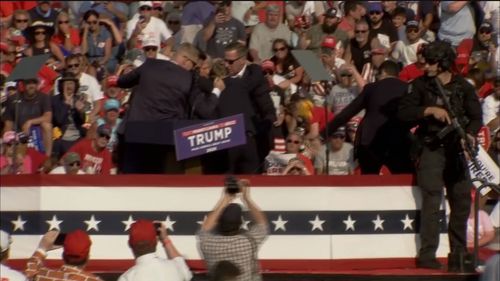 D﻿onald Trump has been rushed off-stage by secret service agents after reported gun shots were heard during a rally in Pennsylvania