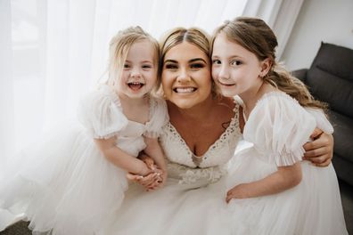Cleo Smith and her little sister Isla as flower girls for their mum, Ellie Smith.
