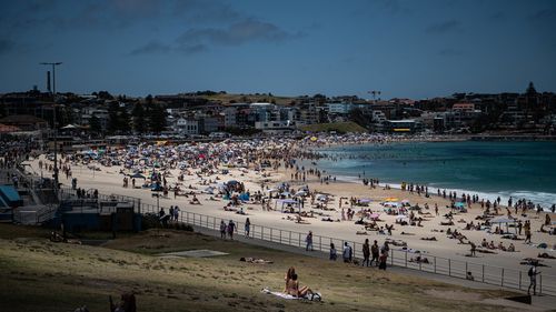 Beachgoers are seen at Bondi Beach in Sydney.