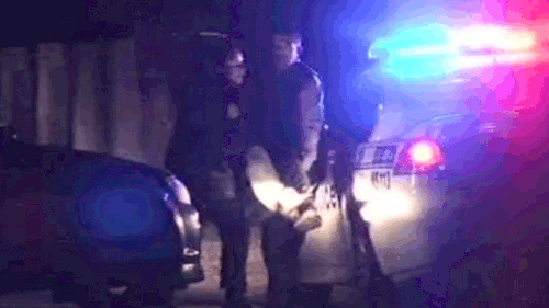 A hostage is carried out by police. (9NEWS)