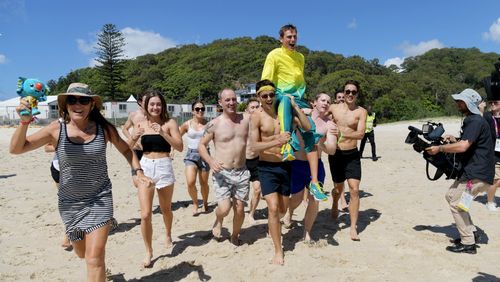 Dane Bird-Smith is carried into the ocean on the shoulders of his friends. (AAP)