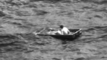 A man who went missing in a 12-foot boat off the coast of Florida is seen moments before being rescued Saturday in a still image taken from footage released by the US Coast Guard.
