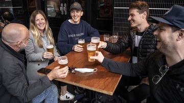 Friends toast to the end of Sydney&#x27;s 107-day lockdown at the Dolphin Hotel in Surry Hills on October 11, 2021.