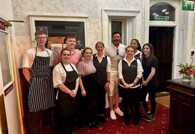 Hugh Jackman with hotel staff