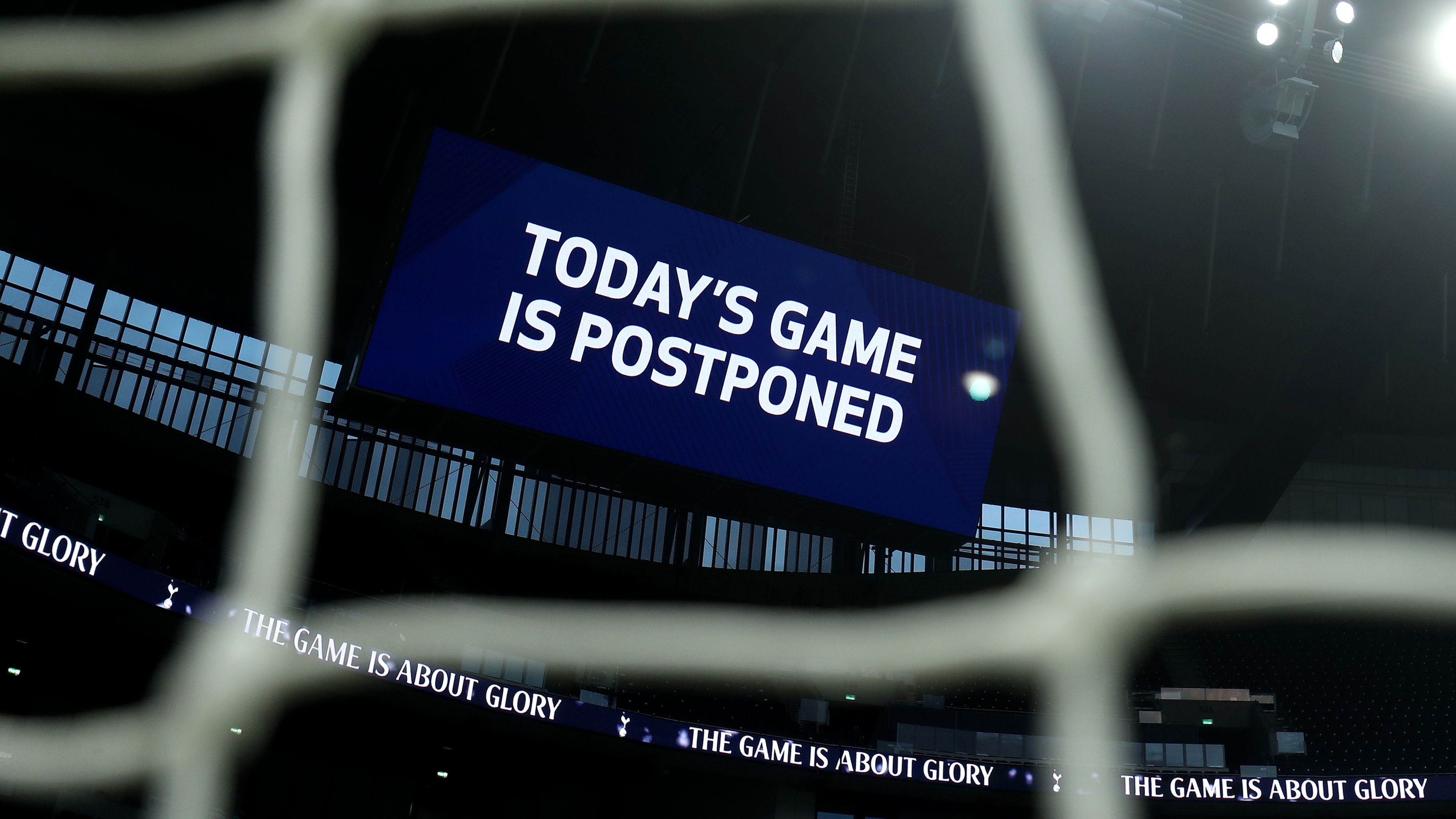 A board inside the stadium displays &#x27;Today&#x27;s Game is Postponed.&#x27;