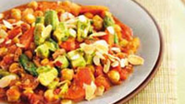 Chickpeas in spicy sauce with avocado salsa and avocado gravy