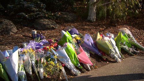 Flowers laid at the site of Rachel Tyquin's death.