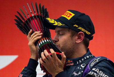 <b>Sebastian Vettel has become Formula One's youngest four-time world champion after winning the Indian Grand Prix. </b><br/><br/>The 26-year-old German has joined Juan Manuel Fangio and Michael Schumacher as the only others to achieve the feat.<br/><br/>Vettel celebrated in spectacular fashion by spinning doughnuts in front of the grandstand. He then stood on top of his Red Bull and saluted the crowd before bowing to his car in mock worship.<br/><br/>(All images Getty)