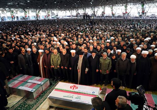 Iran's Supreme Leader Ayatollah Ali Khamenei (centre) leading a prayer as Parliament Speaker Ali Larijani, President Hassan Rouhani, Judiciary chief Ebrahim Raisi and the newly-appointed head of the Islamic Revolutionary Guards Esmail Qaani perform the prayer over the caskets of slain Iranian military commander Qasem Soleimani and Iraqi paramilitary chief Abu Mahdi al-Muhandis at Tehran University in the Iranian capital. 