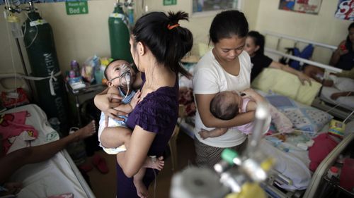 Filipino children, who are suffering from measles, share beds inside an over crowded room at a government hospital in Manila. The Philippines health department declared a measles outbreak in Metro Manila and Central Luzon.