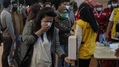 Relatives of Sriwijaya Air flight SJ 182 arrive at the crisis centre in Soekarno Hatta Airport, on January 09, 2021 in Jakarta, Indonesia