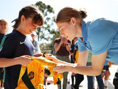 Cortnee Vine of Sydney FC signs autographs for young participants during a Sydney FC Women's Football Legacy Announcement at Sky Park on September 05, 2023 in Sydney, Australia. 