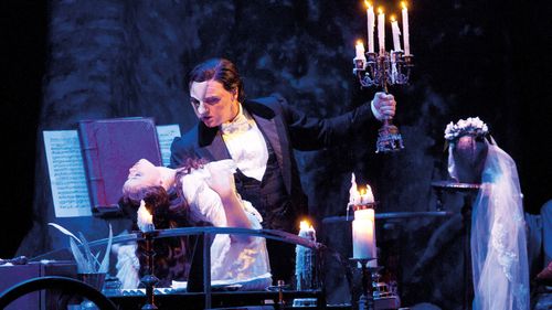 John Owen-Jones as the Phantom Katie Hall as Christine in The Phantom of the Opera in the UK.