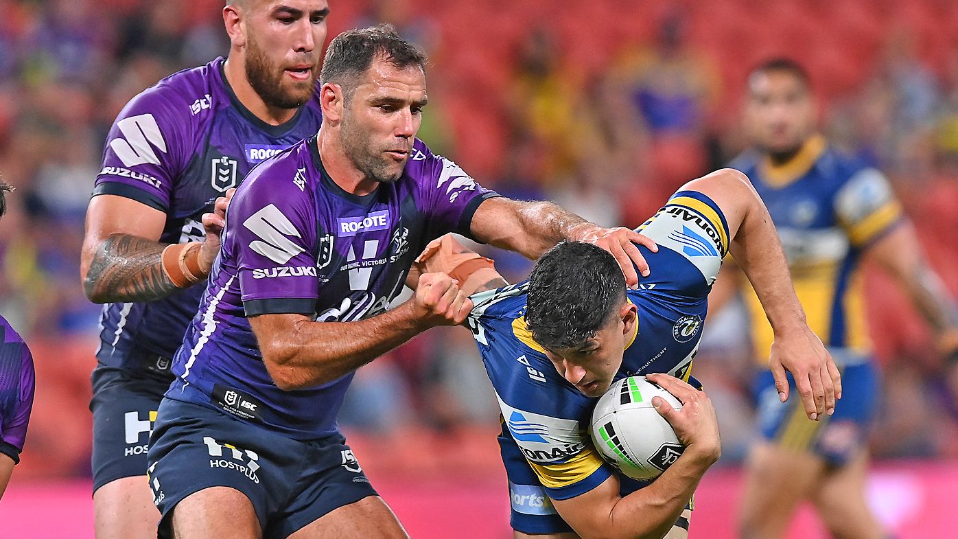 Dylan Brown of the Eels is tackled by Cameron Smith of the Storm 
