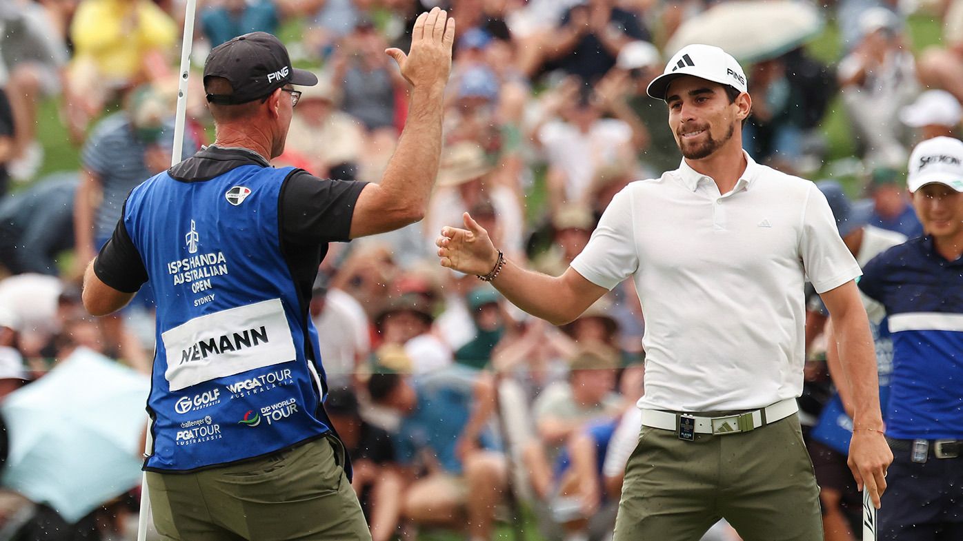 Joaquin Niemann of Chile celebrates winning the Men&#x27;s ISPS HANDA Australian Open with his caddie during the 2nd playoff hole against Rikuya Hoshino of Japan in the ISPS HANDA Australian Open at The Australian Golf Course on December 03, 2023 in Sydney, Australia. (Photo by Matt King/Getty Images)
