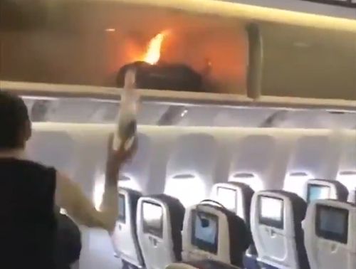 A flight attendant leapt into action, dousing the flames with water. (China News)