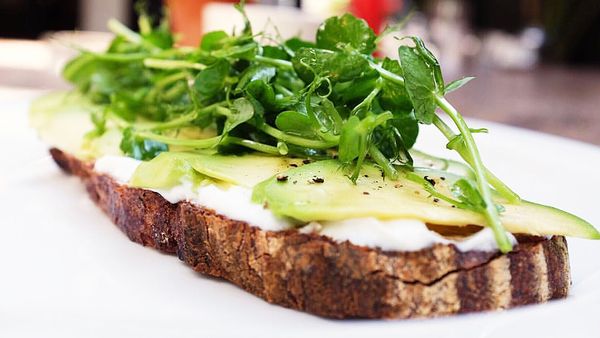 House-made labneh and avo on toast with pea shoots (Clarke's Bar & Dining)