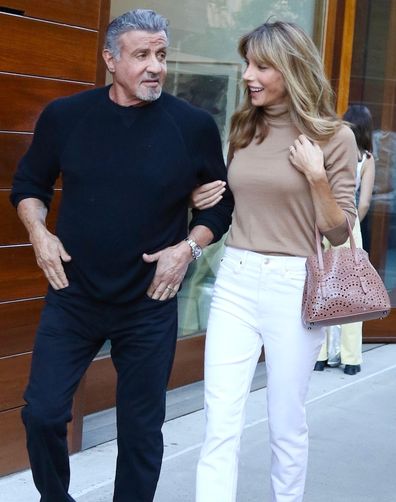 Sylvester Stallone and wife Jennifer Flavin are all smiles while strolling arm in arm in Manhattans Downtown area.    