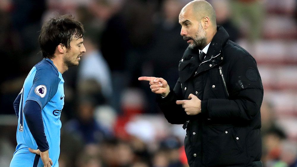 Manchester City coach Pep Guardiola lets David Silva know he was the man in the win over Sunderland. (AAP)