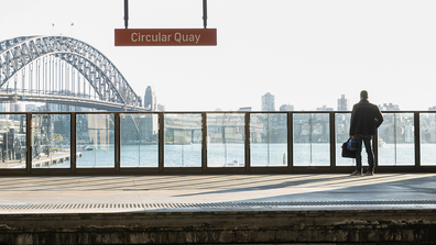 A commuter looks at at Sydney Harbour as he stands on the platform at Circular Quay station on June 01, 2020 in Sydney, Australia. 