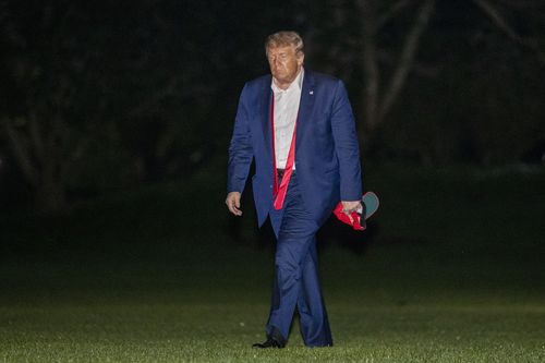President Donald Trump walks on the South Lawn of the White House in Washington, Sunday, June 21, 2020, after stepping off Marine One as he returns from a campaign rally in Tulsa, Okla. (AP Photo/Patrick Semansky)
