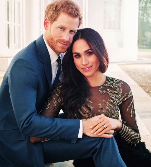 Prince Harry and Meghan Markle pose for one of two official engagement photos, at Frogmore House, in Windsor, England. (Alexi Lubomirski via AP)