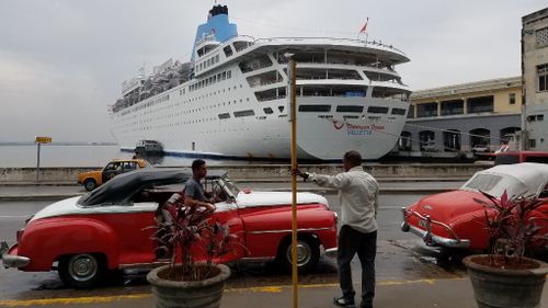 Tourists met by Cuba's iconic vintage cars at the Port of Havana. (9NEWS)