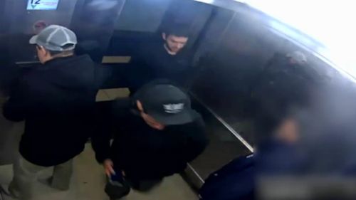 Three men entered the Collingwood apartment elevator, before one punched the victim in the head. 