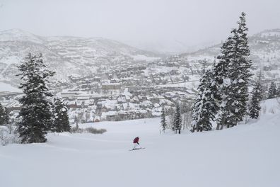A skier makes their way down Park City Mountain, owned by Vail Resorts, as Main Street is seen below during the 2023 Sundance Film Festival, Thursday, Jan. 19, 2023, in Park City, Utah.  