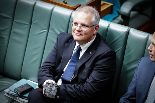 Scott Morrison with a lump of coal during Question Time at Parliament House in 2017.