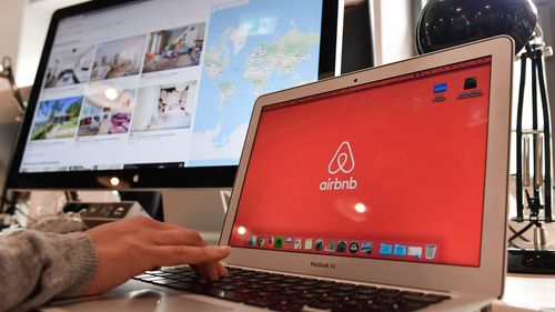 16 April 2018, Germany, Berlin: Airbnb's logo can be seen on different screens in Airbnb Germany GmbH's office in the Neue Schoenhauser Street. Airbnb is a community marketplace for people to book and rent accommodations Private and commercial lessors rent apartments with the support of agencies. Photo: Jens Kalaene/dpa-Zentralbild/dpa (Photo by Jens Kalaene/picture alliance via Getty Images)