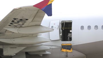 An Asiana Airlines plane is parked as one of the plane&#x27;s doors suddenly opened at Daegu International Airport in Daegu, South Korea, Friday, May 26, 2023. 