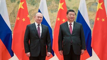 Russia&#x27;s President Vladimir Putin (L) and his Chinese counterpart Xi Jinping pose during a meeting on February 4, 2022. Alexei Druzhinin/Russian Presidential Press and Information Office/TASS