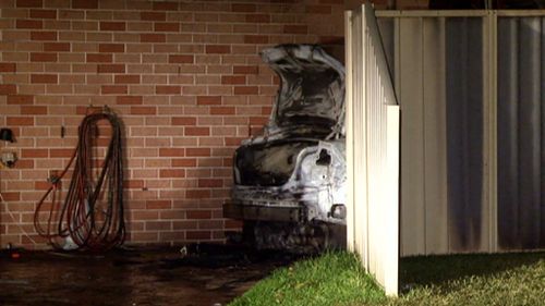 Ten people evacuated after car set alight next to home in Sydney's west