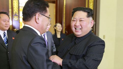  Kim Jong Un, left, shakes hands with South Korean National Security Director Chung Eui-yong in Pyongyang, North Korea.  (AAP)