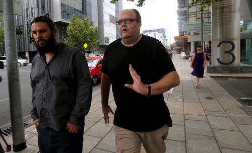 Oakden whistleblowers Clive Spriggs and Stewart Johnston are seen outside the first public hearing of the aged care royal commission in Adelaide.