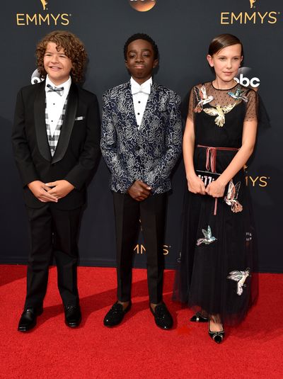 3. Bobby Brown, Valentino Red dress, Edie Parker bag and Nicholas Kirkwood shoes. With Gaten Matarazzo and Caleb McLaughlin.