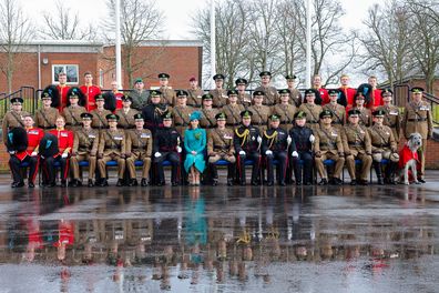 Catherine, Princess of Wales and Prince William, Prince of Wales sit for official Officers and Sergeants Mess photographs after the St. Patrick's Day Parade at Mons Barracks on March 17, 2023 in Aldershot, England. 