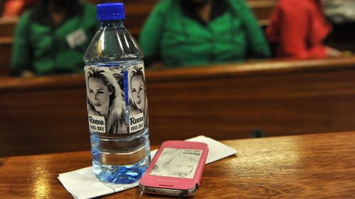 A water bottle with stickers of Reeva Steenkamp's face. (AAP)